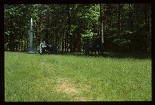 Landscape with monument in background. Color photo. 