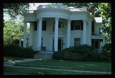 House with pillars. Color photo.