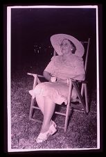 Woman in chair. Black and white photo.