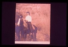 Woman on a horse. Black and white photo.