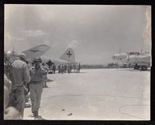 Japanese dignitaries on airfield tarmac