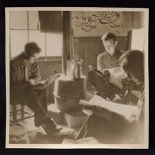 James L. White with two others reading