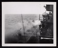 First hit on USS Saratoga. Milton Fields manning movie camera in upper right background. 