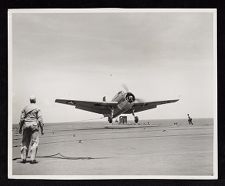U.S. warplanes taking off and landing on USS Saratoga.  