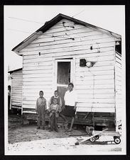 Family in Front of House