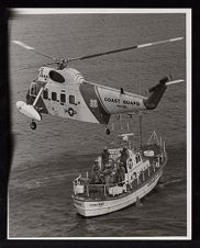 Coast Guard helicopter and USCGA boat