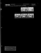 Group looking at a newspaper (5 Negatives), April 4-5, 1966 [Sleeve 9, Folder d, Box 39]