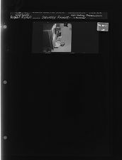 Man reading 'Protestantism in America' (1 Negative) (August 10, 1963) [Sleeve 28, Folder c, Box 30]