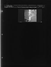 Photo of football player sitting on desk (1 Negative) (August 13, 1963) [Sleeve 35, Folder c, Box 30]