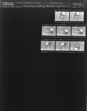 Man putting something into tube in ground (8 Negatives), July 1-3, 1964 [Sleeve 2, Folder c, Box 33]