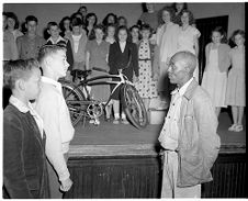 Janitor receiving a Bicycle 