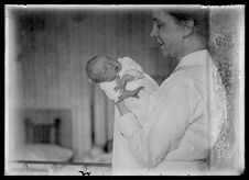 Female nurse holding an infant