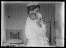 Female nurse holding an infant