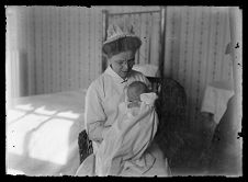 Female nurse holding an infant