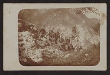 Nine men in uniform on mountain