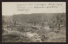 Uniformed soldiers in a debris-ridden battlefield