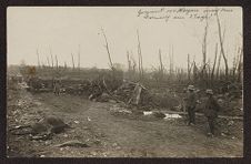 Soldiers in a debris ridden battlefield