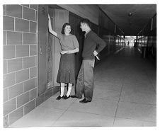 Peoplel standing in a school halway