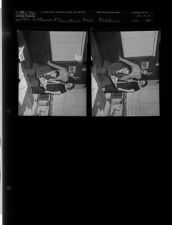 Martha's Saturday feature - Group looking at paper (2 Negatives), April 25-26, 1958 [Sleeve 33, Folder e, Box 14]