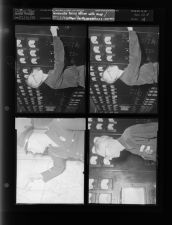 Greenville police officer with map; Man working with what appears to be electrical equipment (4 Negatives) (December 21, 1957) [Sleeve 19, Folder d, Box 13]