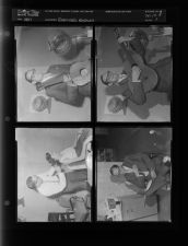 Photos of man playing guitar, doing woman's hair, and reading (4 Negatives), 1957, undated [Sleeve 1, Folder f, Box 13]