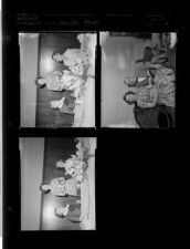 Janette Mayo reads book (3 Negatives) (September 26, 1957) [Sleeve 35, Folder f, Box 12]