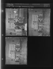 Women receiving award in front of National Guard Banner on Achievement Day (3 Negatives) (November 1, 1954) [Sleeve 5, Folder c, Box 5]