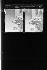 Man and woman at desk (2 Negatives) December undated, 1954 [Sleeve 82, Folder d, Box 5]