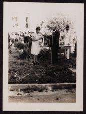 Unknown Man and Woman at a Microphone