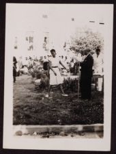 Unknown Woman Approaches a Microphone