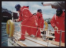 Three Coasties in Red Suits