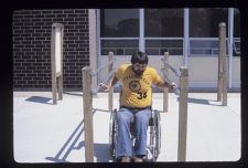 Man in wheelchair on campus
