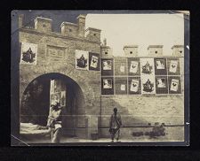 Cigarette ads on wall entrance to city in China