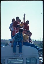 Pi Kappa Phi brothers sitting on top of a bus