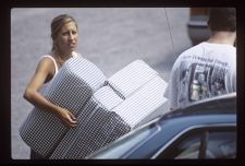 Student holding items