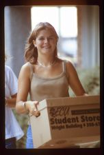 Student carrying a box