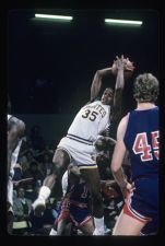 Men's Basketball player jumping for a shot