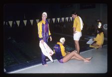 Women's Swimming Team beside pool