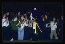 Student hugging man dressed like a pirate