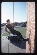 Army ROTC Cadets repelling down a wall