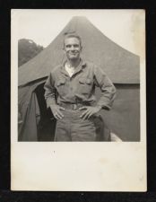 Max Ray Joyner, Sr., posing in front of barracks