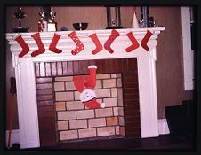 Slide of Christmas stockings in Alpha Phi Omega house