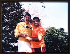 Slide of two Alpha Phi Omega brothers