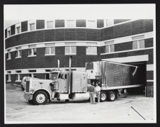 Delivery truck docked outside of Joyner Library