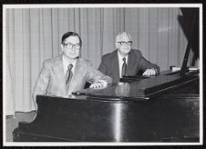 Dean Everett Pittman and Assistant Dean Charles Stevens sitting at pianos