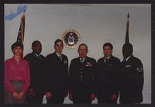 Photograph of Joan Phillips posing with Air Force officers