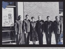 Photograph of Joan Phillips posing with Air Force officers