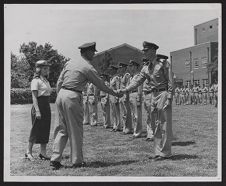 Photograph of ECU Air Force ROTC commander shaking cadets' hands