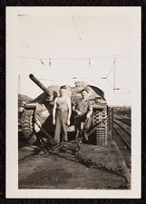 Two U.S. Army soldiers standing in front of captured German tank