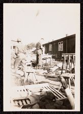 Two US Army soldiers amidst rubble